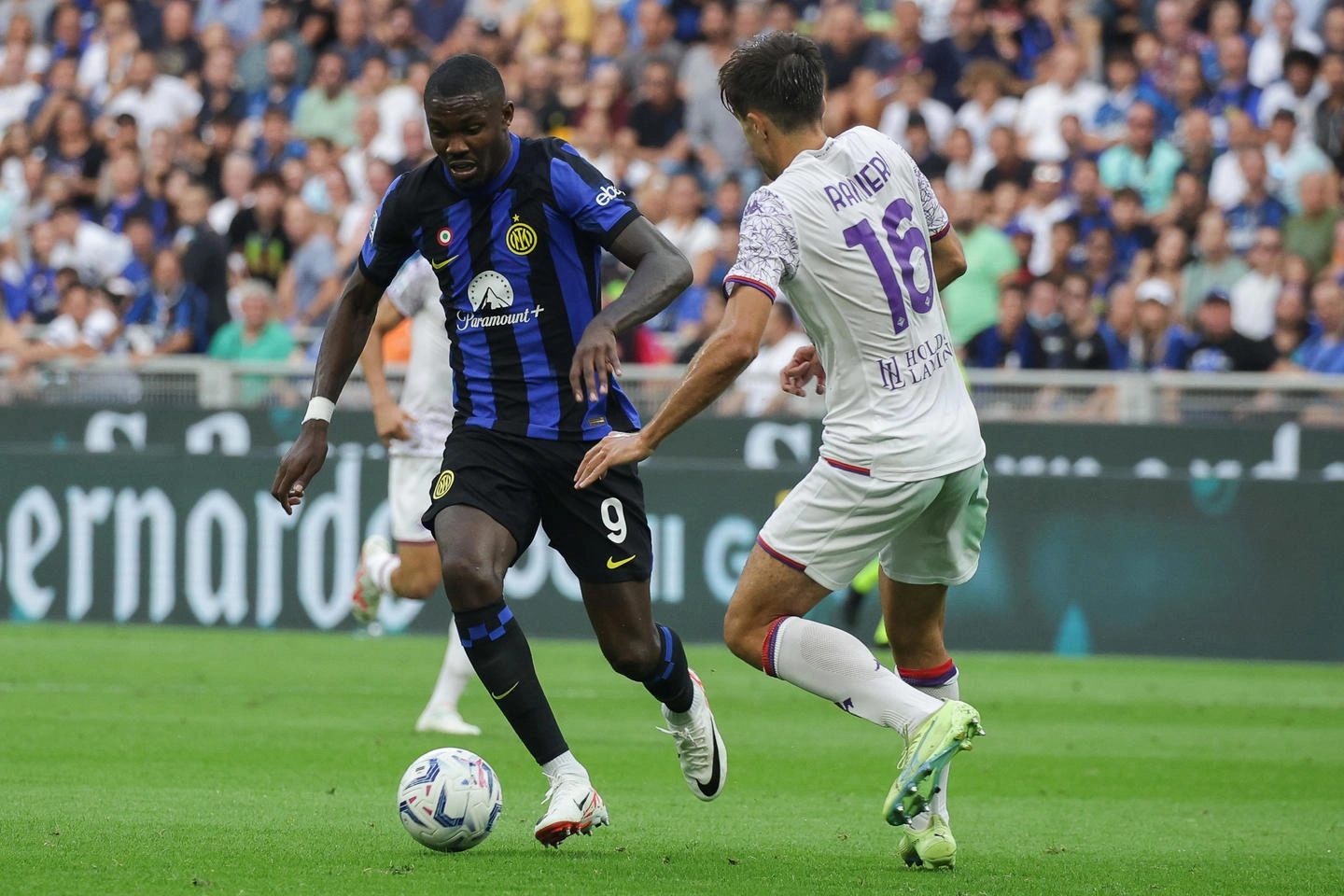FC Inter's forward Marcus Thuram in action against Fiorentina's defender Luca Ranieri during the Italian serie A soccer match between Fc Inter and Fiorentina at  Giuseppe Meazza stadium in Milan, 3 September 2023.ANSA / MATTEO BAZZI