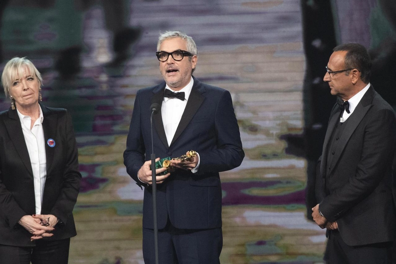 Piera Detassis, Alfonso Cuaron e Carlo Conti (foto Ansa)