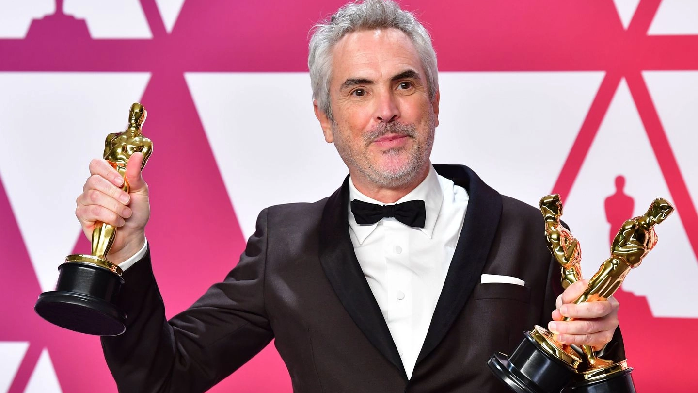 Alfonso Cuarón con i tre Oscar vinti