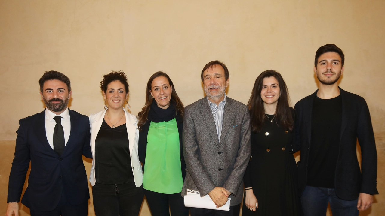 Il rettore Dei con Irene Ghaleb, Alessandra Moresi e Alessio Franchino