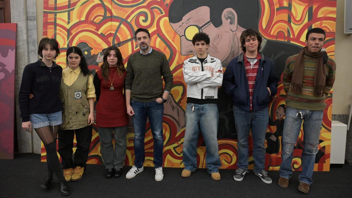 murales in ricordo di don aldo mei le opere esposte a palazzo ducale importante progetto