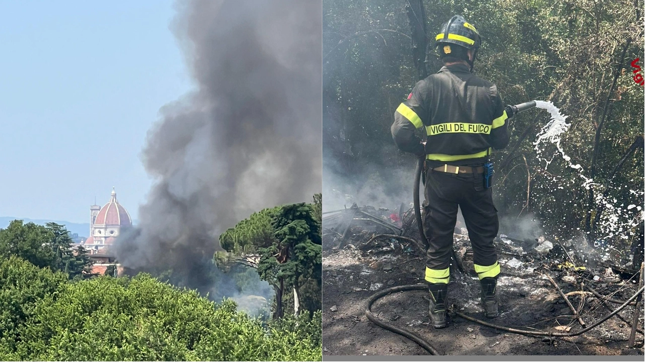 Vigili del fuoco al lavoro e la colonna di fumo che si vedeva in gran parte della città