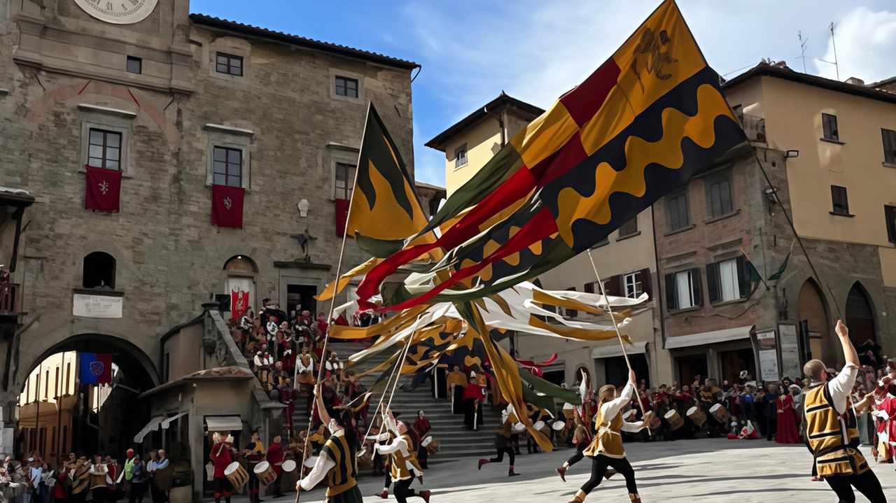 L’esibizione degli sbandieratori e dei musici del Gruppo storico prima. della sfida a colpi di balestra tra i quintieri