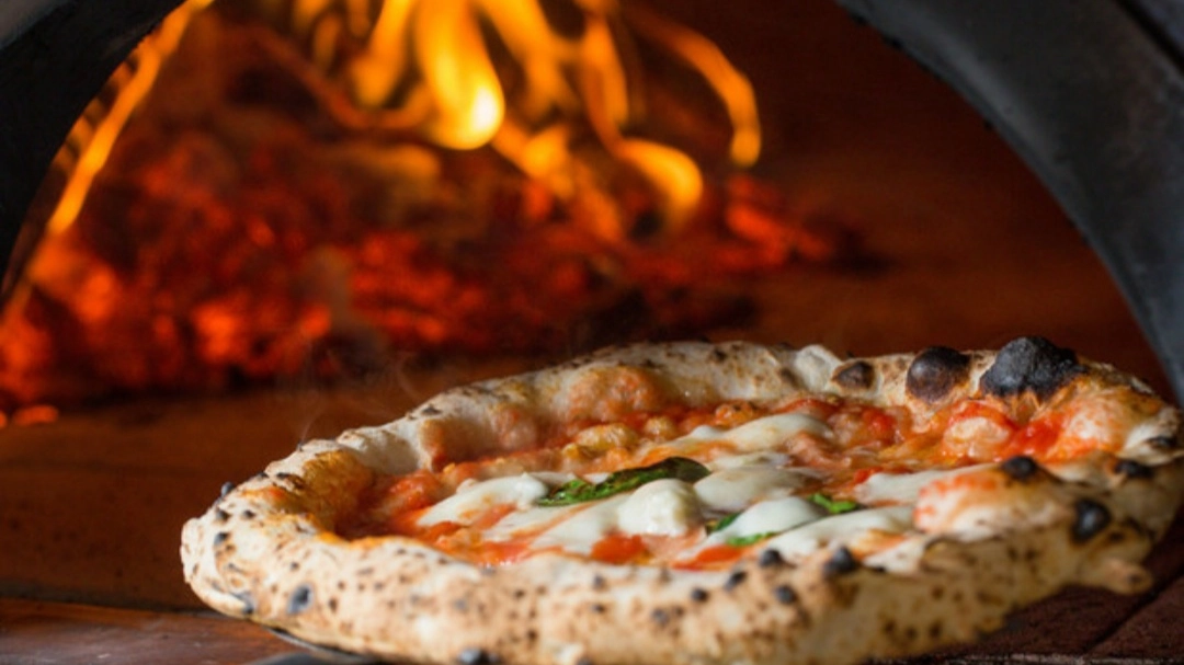 Pizza (foto Ansa) Pizza (foto Ansa)