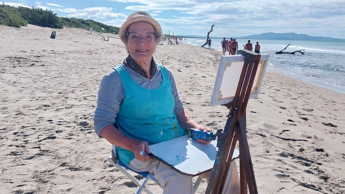 https://www.lanazione.it/image-service/view/acePublic/alias/contentid/ZmIzYThjMDktNGU0MC00/0/grazia-baldini-83-anni-nella-sua-postazione-di-lavoro-al-mare-ogni-mattina-uno-scorcio-diverso-fissato-con-i-colori.jpeg?f=16:9&w=1200&h=630