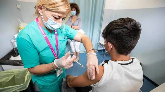 A boy receives a vaccine against Covid-19 on the occasion of the first junior Open day dedicated to children between 12 and 16 years has started in Rieti, Lazio Region Italy, 06 June 2021. ANSA/ MASSIMO PERCOSSI